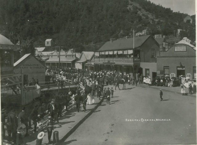 Charity carnival Walhalla, Victoria ca 1910 with hotel, bandstand visible
