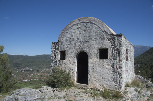The outside of a small stone church.