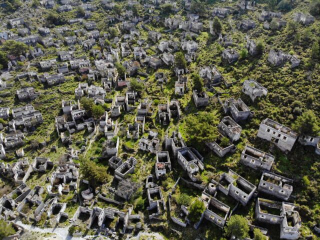 Aerial view of several stone buildings.