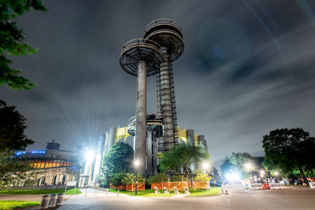 Two of the Astro-View observation towers that make up the New York State Pavilion at night