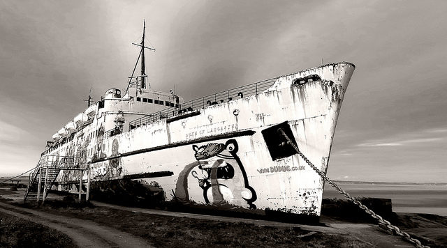 The mural of John ‘Jack’ Irwin bearly visible on the side of the ship. Author Kerys CC BY 2.0