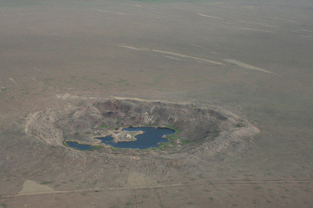 A number of craters created from nuclear tests. Author: The Official CTBTO Photostream CC-BY 2.0