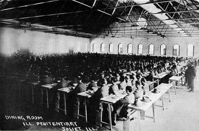 Old photo of inmate dining room. 