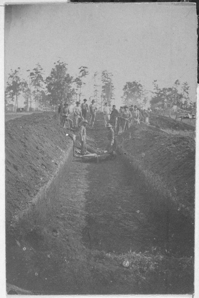 One of the mass graves. U.S. National Archives and Records Administration .