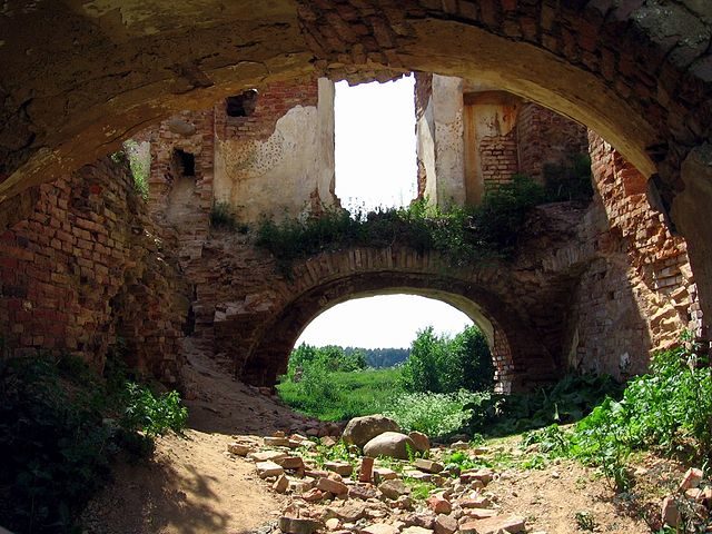 The first floor is under ground covered with layers of soil and piles of stones and bricks