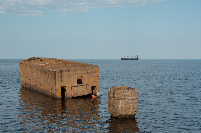 Outside of the Duluth Shipping Canal is a concrete structure known as “The Cribs” or “Uncle Harvey’s Mausoleum” – Author: Pete Markham – CC BY 2.0