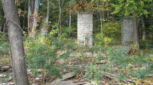 Three pillars of the entryway still remain