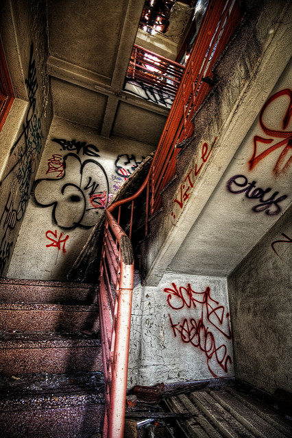 Abandoned asylum stairwell. Author: Adam Selwood – CC BY 2.0