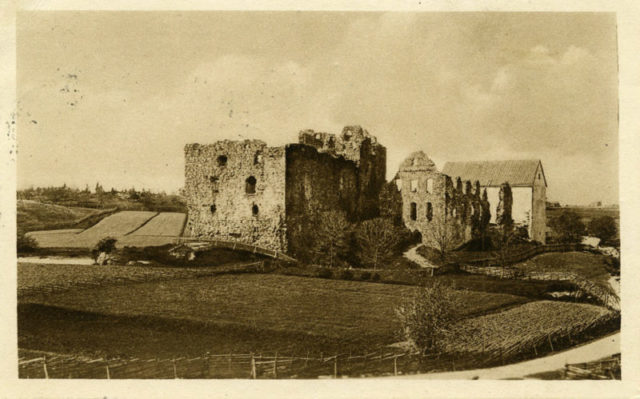 An old photo of the castle in ruins.
