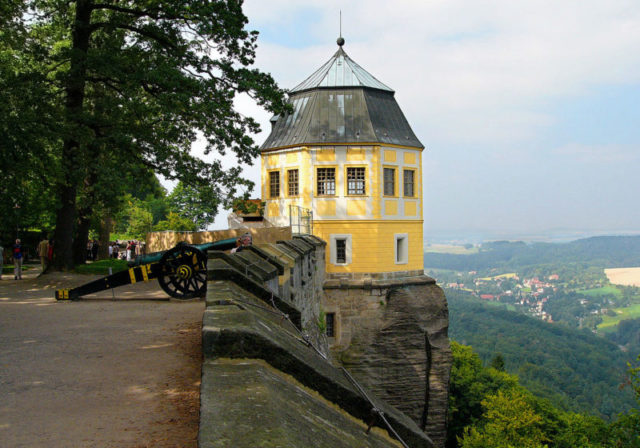 On top of one of the walls.