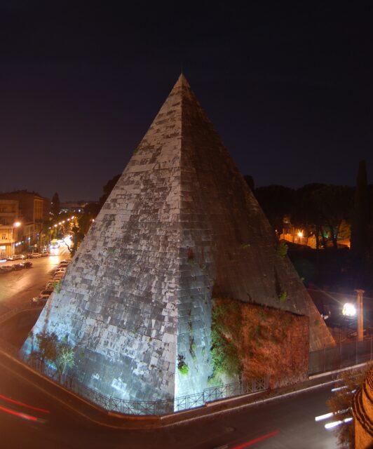 A pyramid at night.