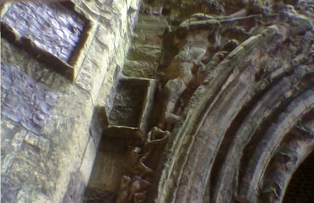 Carved detail on the gate, now inside the remains of the drainage watermill/ Author: IanOfNorwich – CC BY-SA 3.0