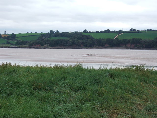 The barges were carried upstream on the current before running aground on a sandbank. Author: Rachel White – CC BY-SA 3.0