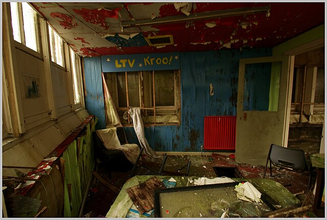 Debris and furniture scattered across a room