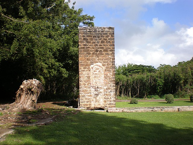 Brick chimney in the middle of a field