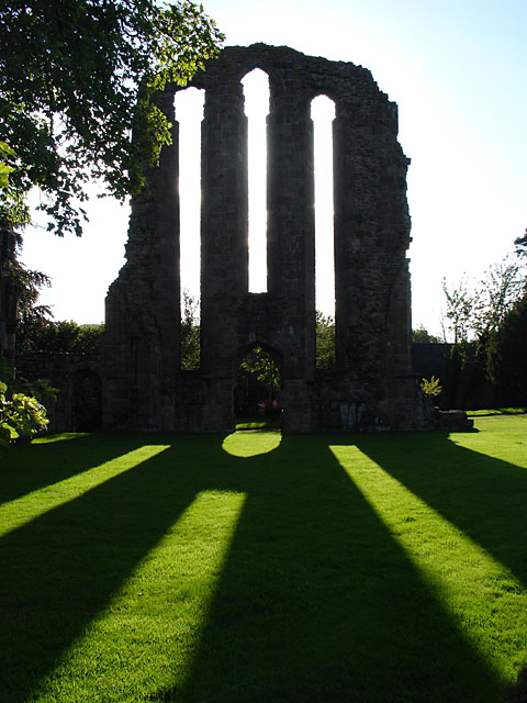 Stone ruin wall with three windows.