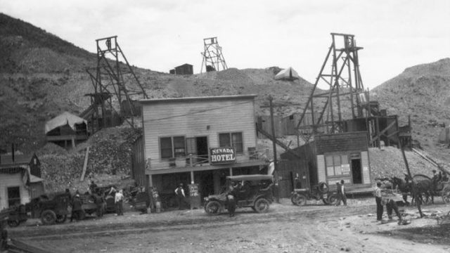 The Nevada Hotel, Office of Fidelity Securities Corporation Brokers and mines in Rawhide, c. 1910. A sign in front of the hotel reads: Car for Schurz at 11 a.m.