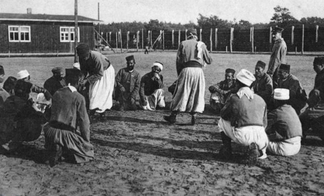 Not all of life was unpleasant at the camp. Some of the POWs can be seen here singing and dancing.