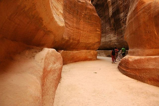 The narrow passage (known as Siq) that leads to Petra (located in southern Jordan), a city carved entirely into rock and one of the centres of the southwestern edge of the Silk Road – Author: Emilio – CC BY-SA 2.0