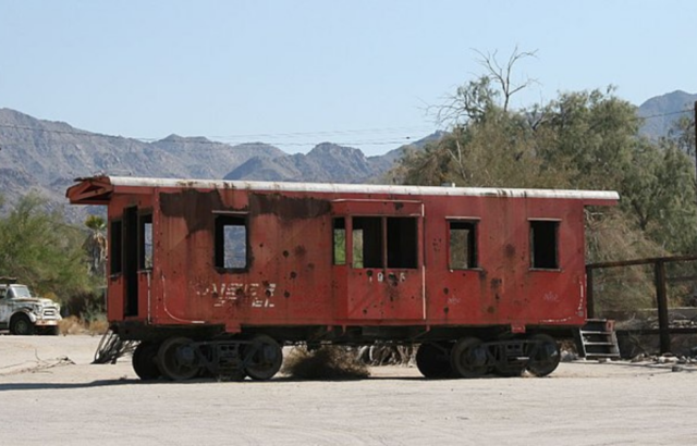 Train caboose left in the middle of a road