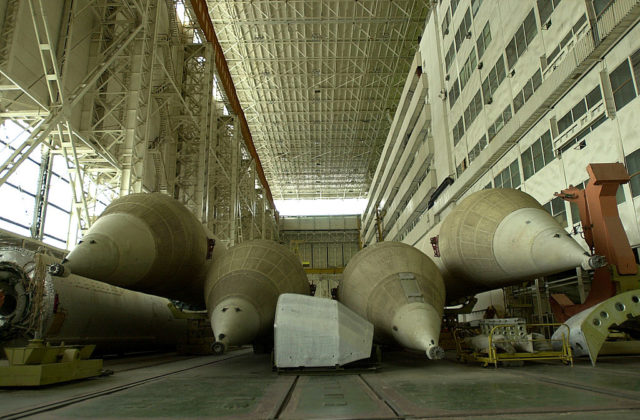 Pieces of equipment scattered within the assembly and refueling complex at the Baikonur Cosmodrome