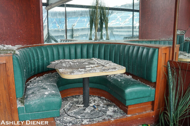 Restaurant booth and table covered in debris