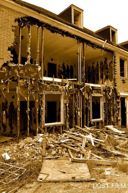 Damaged wall exposing the interior of a building at Henryton State Hospital