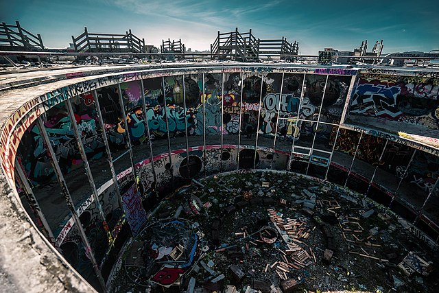 Circular building covered in graffiti