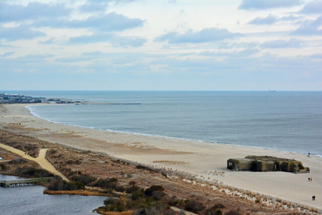 People walking along the beach, near Battery 223