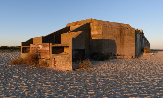 Exterior of Battery 223, with a "KEEP OUT" sign nailed to it