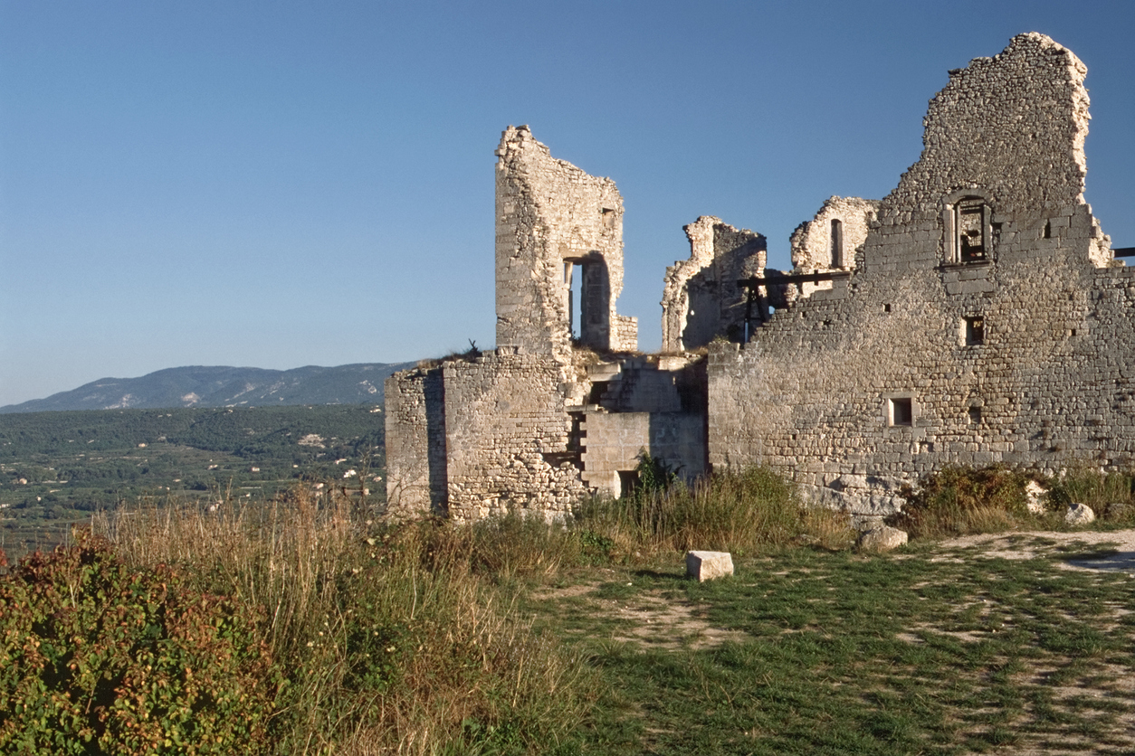 "The ruins of the castle of Marquis de Sade in the warm light of an late september afternoon. Located in the little village Lacoste, (Vaucluse, Provence). In the background the Luberon."