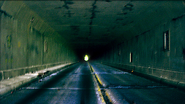 Road running through the darkened interior of the Rays Hill Tunnel