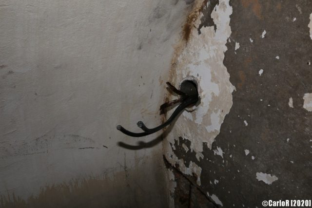 Old wires poking out from an electrical socket. (Photo Credit: CarloR)