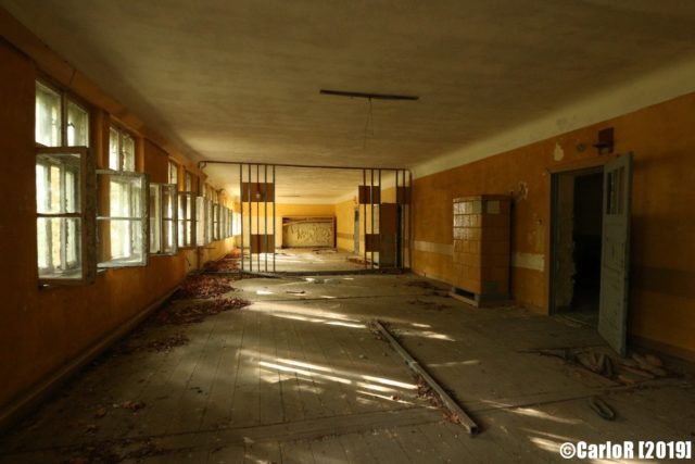 Large hallway with an open security gate in the middle