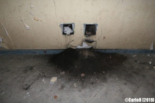 Burnt power sockets with ash on the ground below