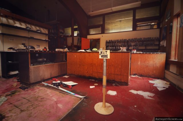 "Wait Here" sign in front of a roller skating kiosk within the Nevele Grand Resort