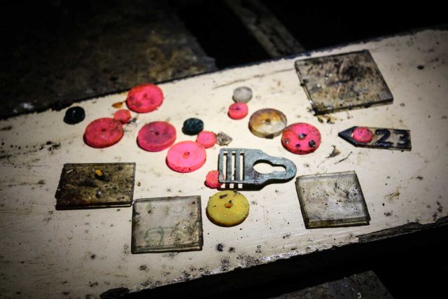 Buttons and pieces of glass on a white table