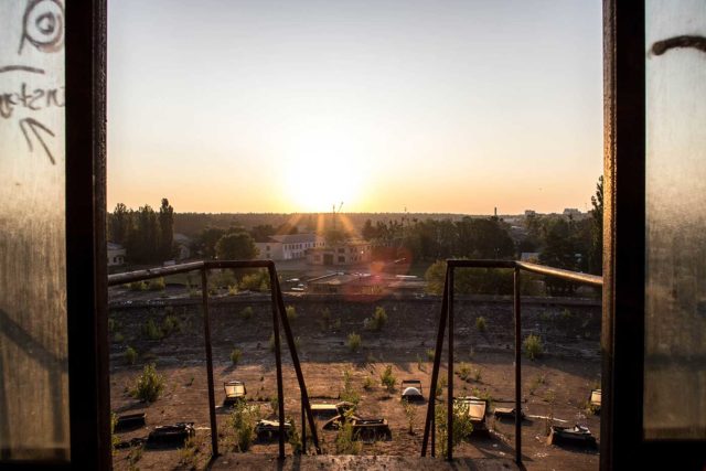 View of the sunset through an open window