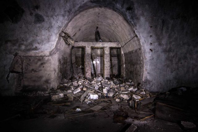 Tunnel entrance blocked by a pile of rubble