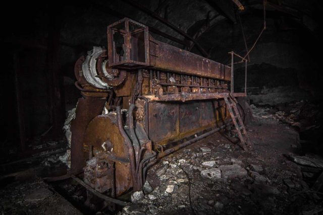 Rusty metal equipment in a dark room