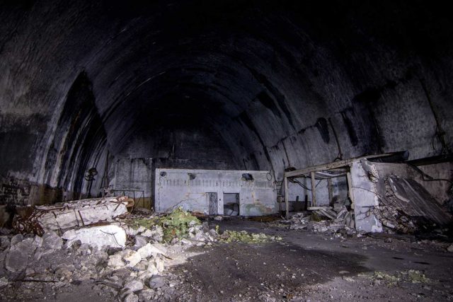 Crumbled cement and damaged steel within Željava Airbase