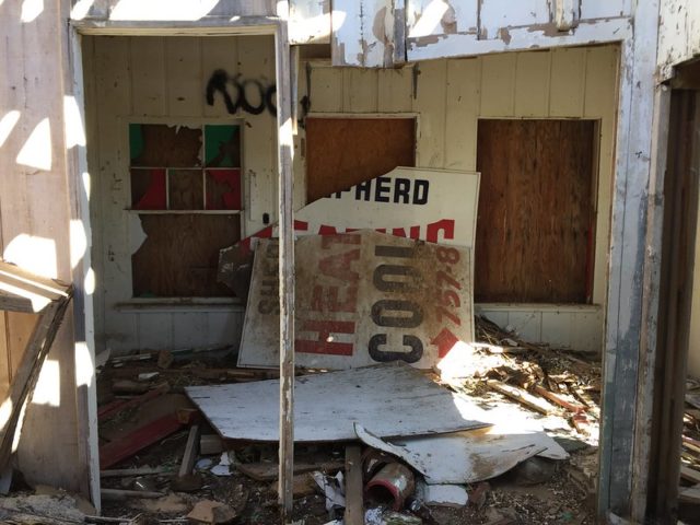 Broken sign in a darkened room