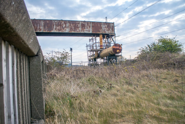 Rusty fuel tank atop metal supports