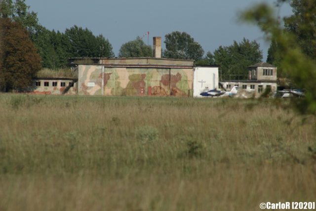 Concrete building painted in camouflage