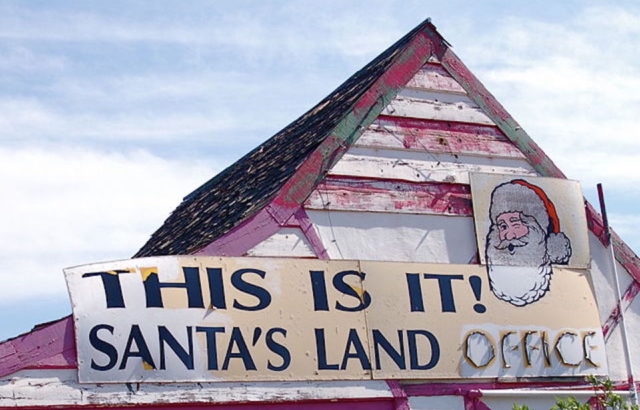 Rooftop with a sign that reads "This is it! Santa's Land Office"