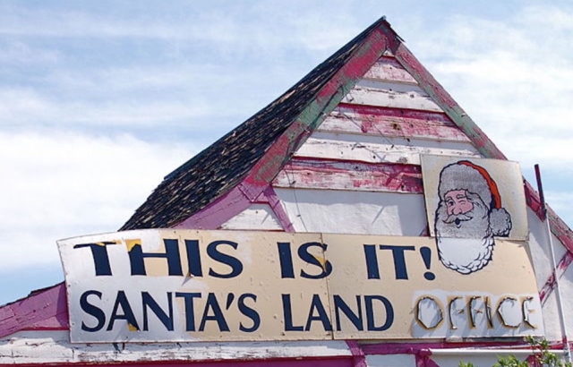 Rooftop with a sign that reads "This is it! Santa's Land Office"