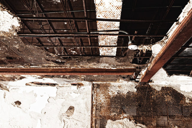 Exposed piping on the ceiling within the Burwash Correctional Center