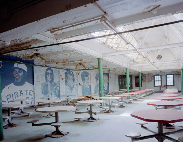Empty dining room with images of baseball players along the wall