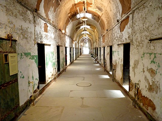 Empty, derelict hallway within Eastern State Penitentiary