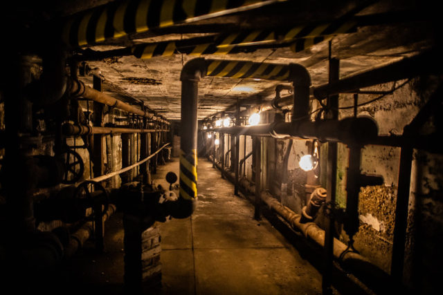 Pipes in a dimly-lit room